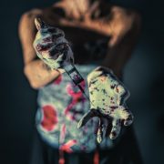 close up photo of person with paint on her hands