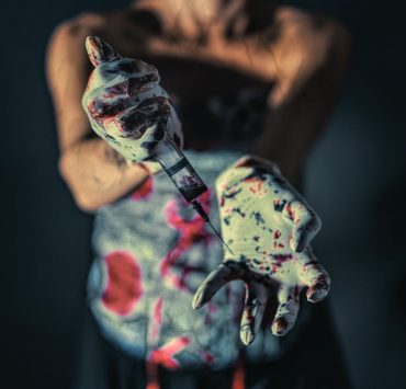 close up photo of person with paint on her hands