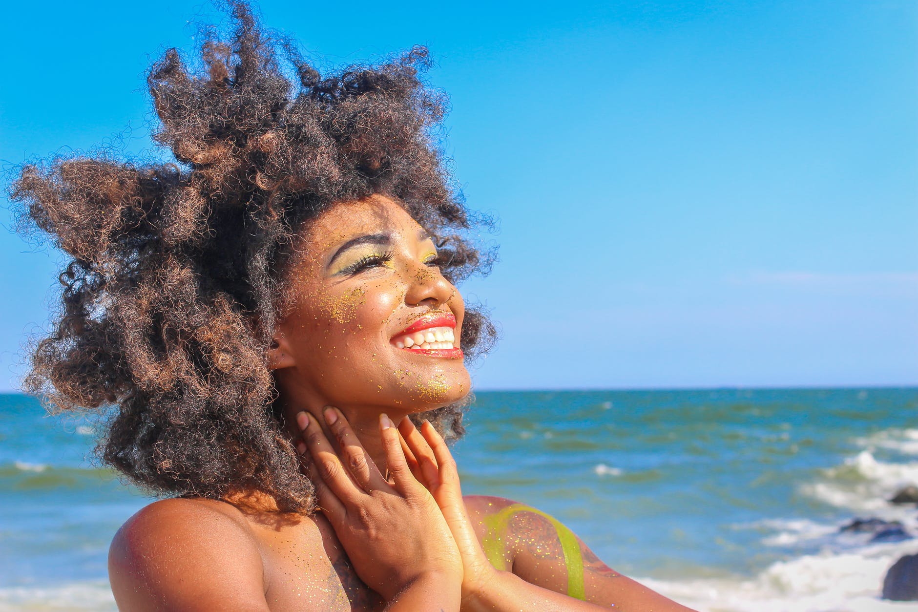 close up photo of woman with afro hair