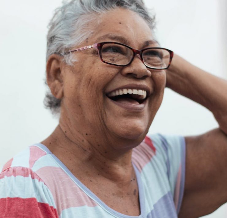 cheerful elderly woman looking away