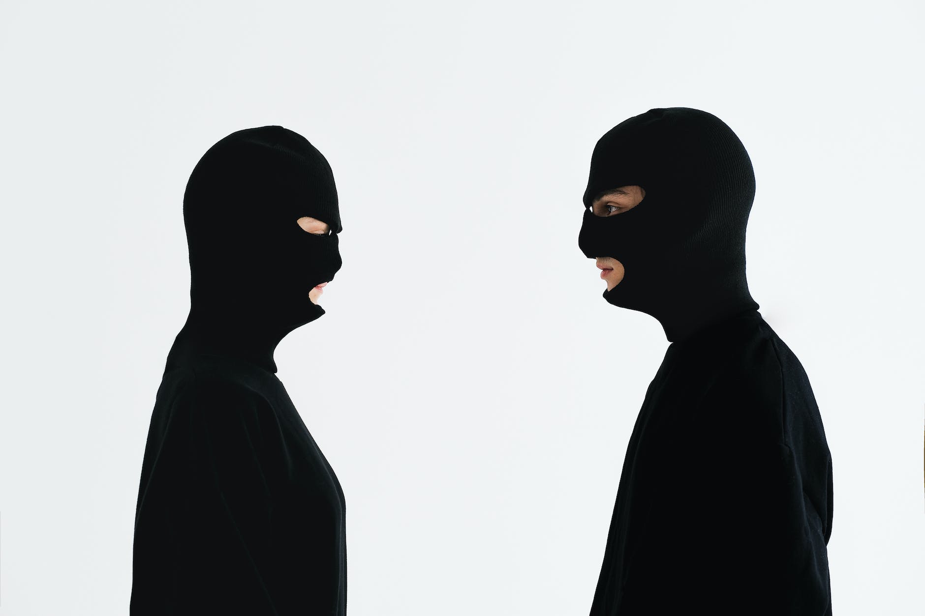 close up shot of two people wearing robber mask