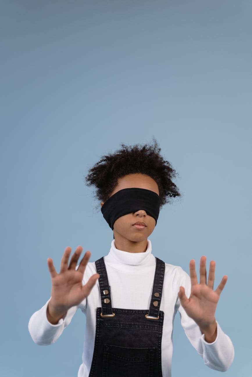 a kid blindfolded with black cloth