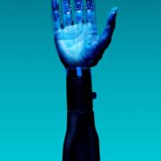prosthetic arm on blue background
