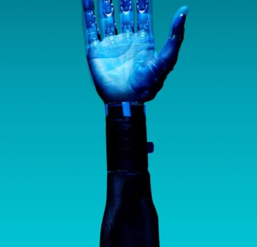 prosthetic arm on blue background