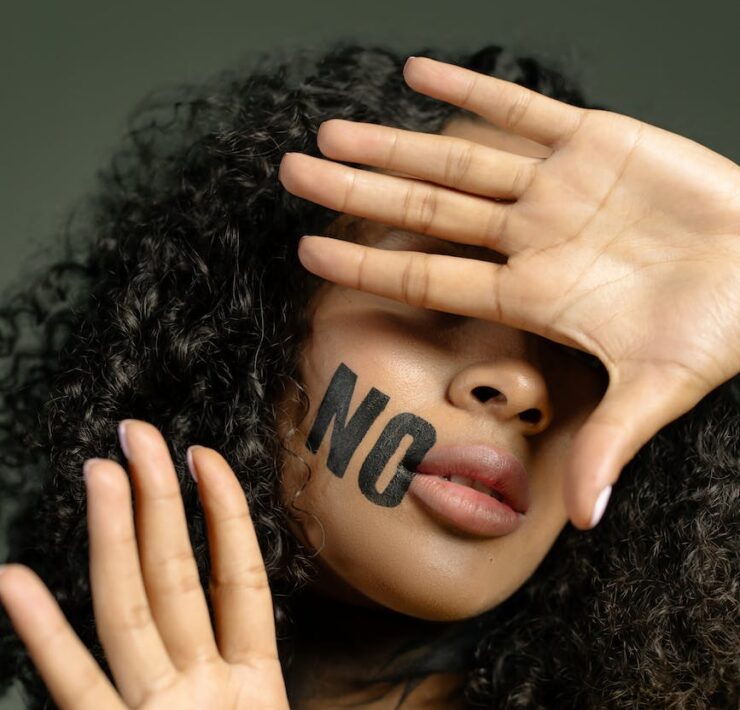 close up photo of woman covering her face