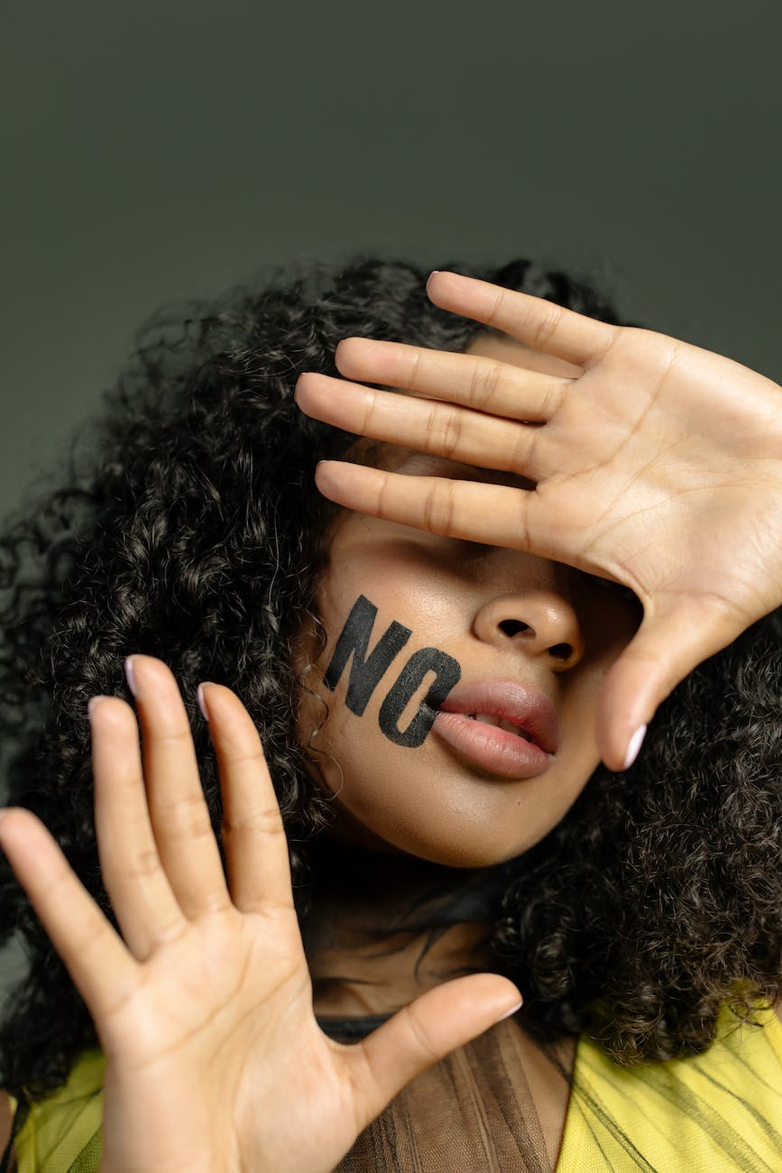 close up photo of woman covering her face