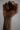 crop black person raising fist