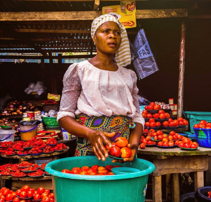 woman holding tomatoes