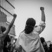 women raising their fists in protest