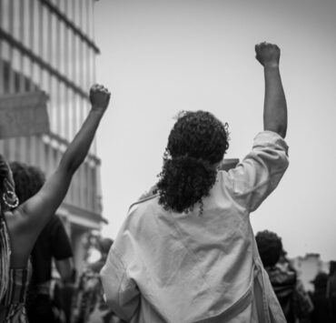 women raising their fists in protest