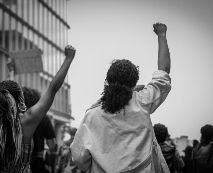 women raising their fists in protest