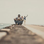 man sitting reading a book