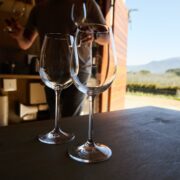 wineglasses on table in barn at vineyard