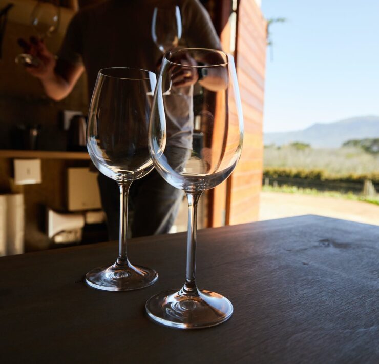 wineglasses on table in barn at vineyard