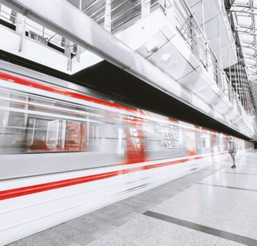 blurred motion of illuminated railroad station in city