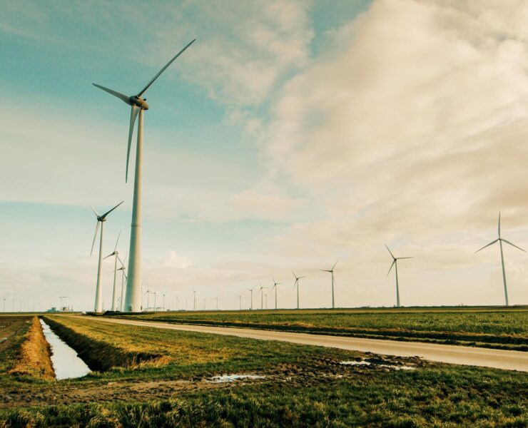 windmill energy on green grass field