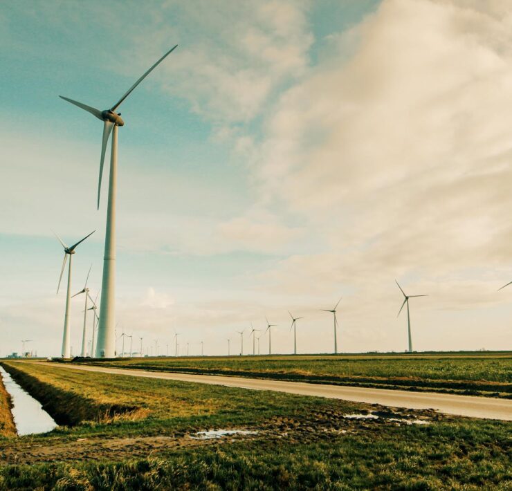 windmill energy on green grass field