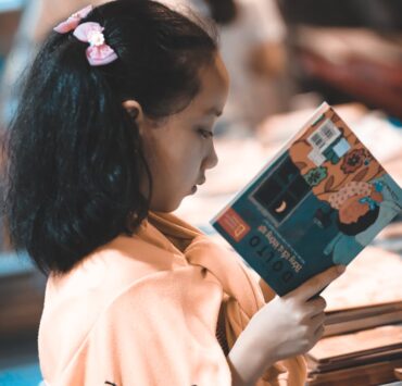 girl holding a story book