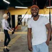 man posing inside a gym