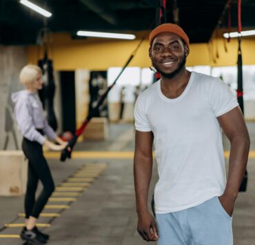 man posing inside a gym