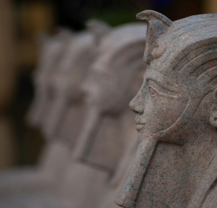 sphinx stone sculpture in row