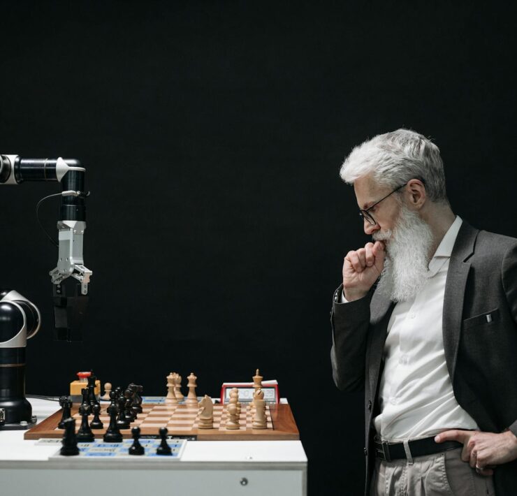 elderly man thinking while looking at a chessboard