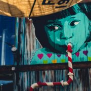 child sipping from pipe graffiti