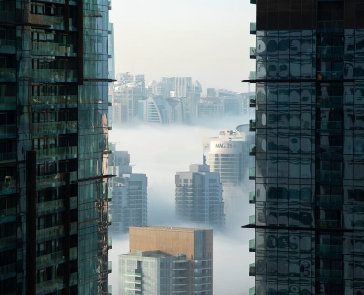 high rise buildings covered with fog